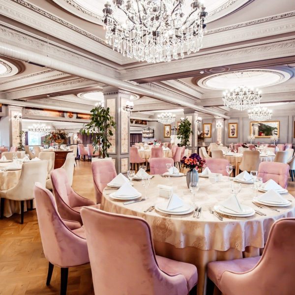restaurant-hall-with-round-square-tables-some-chairs-plants_140725-8033
